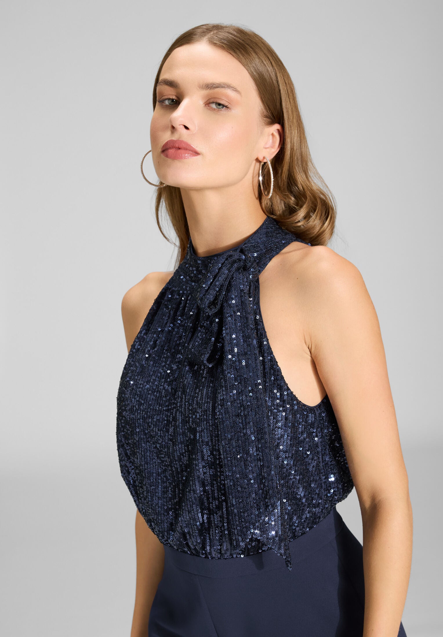 Ärmelloser Jumpsuit mit Schluppenblusen Top aus elastischer Paillette