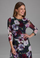 Midi Kleid aus bedrucktem Mesh mit Drapierung im Oberteil